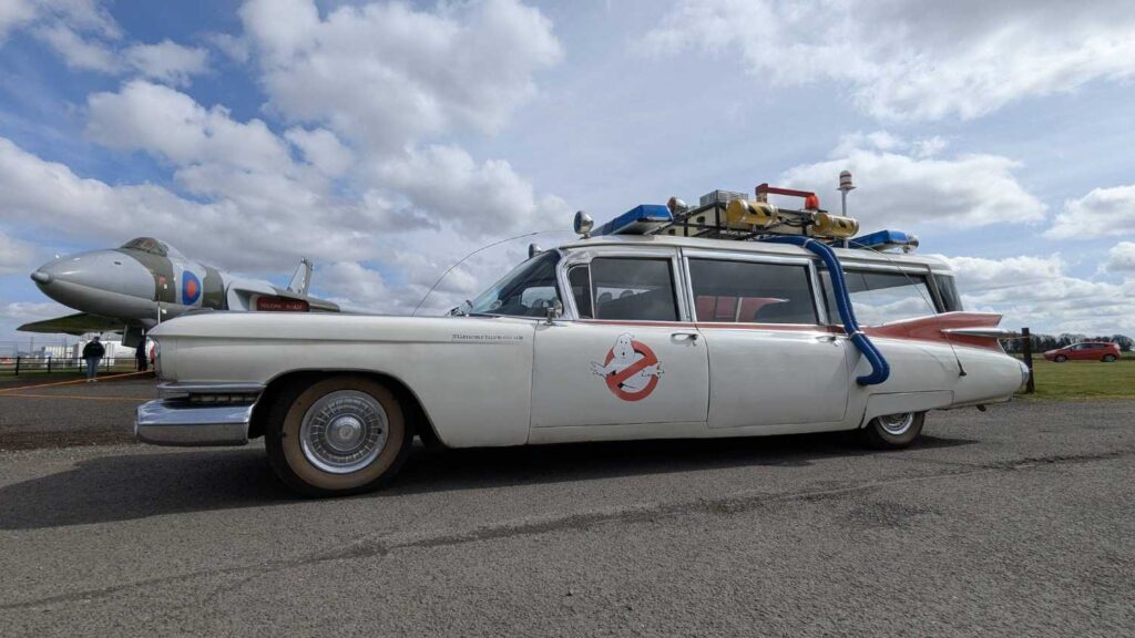 Driver side view of Ecto-1 with the Vulcan in the background.